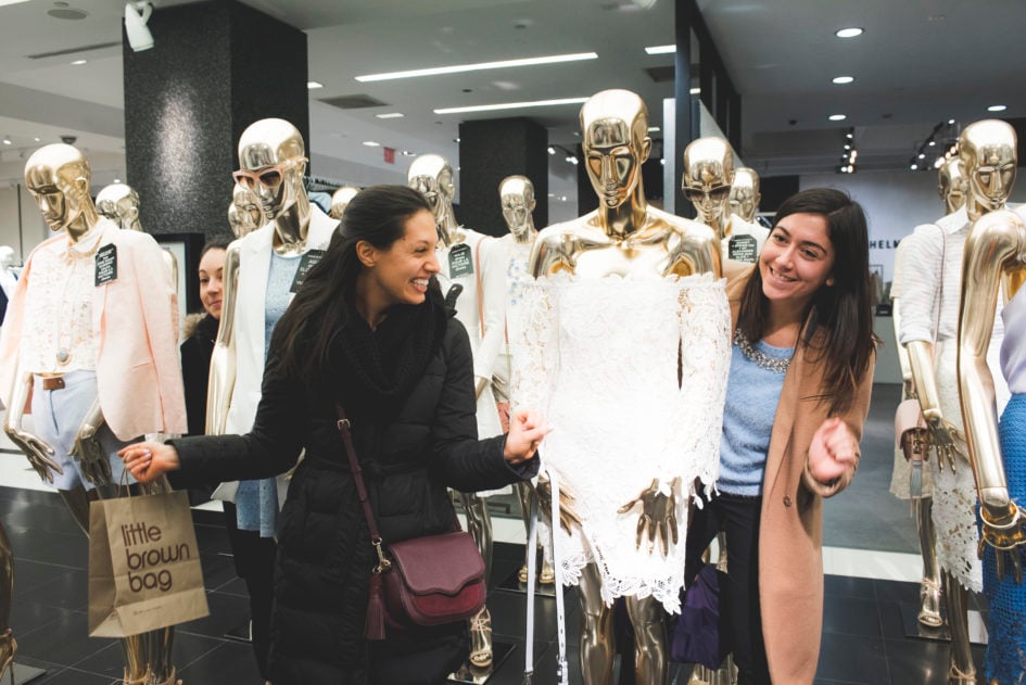 Scavenger hunt participants pose with a mannequin.