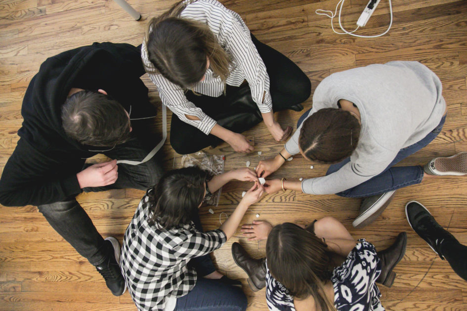 A team works together to build a strong structure.