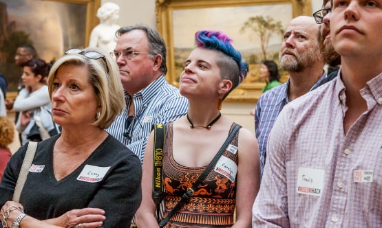 Guests on tour at the museum. Super cool hair.